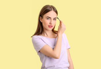 Sticker - Young woman undergoing eyebrow correction procedure on color background