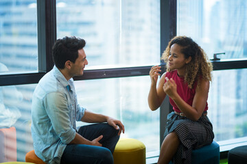 2 business partners meeting and talking in the modern office in the morning