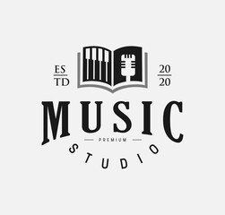 Wall Mural - Open music book logo design with black piano and mic For Music Studio.