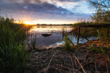 Fototapeta Zachód słońca - Beautiful peaceful sunset or sunrise panoramic view of water of lake or river.