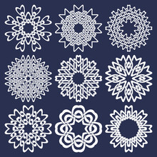 Set Of Eight Pointed Circular Patterns In Oriental Intersecting Lines Style. Nine White Mandalas In Snowflakes Form On Blue Background.