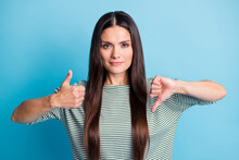 Portrait Of Calm Attractive Lady Show Two Hands Thumb Up Down Wear White Green Isolated On Blue Color Background