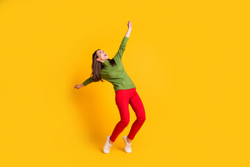 Sticker - Full length body size view of attractive overjoyed cheerful girl jumping dancing having fun isolated bright yellow color background