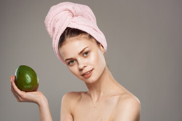 woman with bare shoulders clear skin health vitamins close-up mango