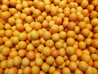 a lot of ripe orange oranges, orange background