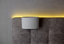 Illuminated Backrest Of A Bed With A White Lamp.