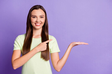 Sticker - Photo of attractive person arm hold product direct finger empty space wear light green isolated on violet color background