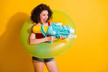 Sticker - Photo of pretty playful curly hairstyle girl lady model have great time friends trip sea spray water gun wear green float circle trendy outfit isolated yellow color background