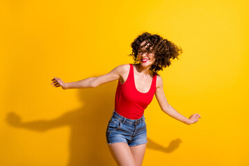 Wall Mural - Portrait of her she nice attractive lovely glamorous cheerful cheery carefree wavy-haired girl dancing fooling having fun isolated bright vivid shine vibrant yellow color background