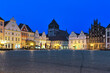 Greifswald, Germany. Evening view of Market square with medieval Hanseatic burgher houses and Church of St. Mary on background.