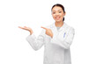 © Syda Productions - medicine, profession and healthcare concept - happy smiling asian female doctor in white coat holding something invisible on her hand