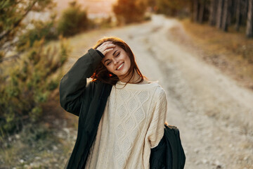 woman hiker on the road outdoors lifestyle smile autumn