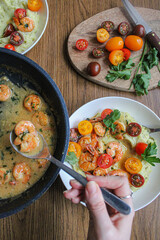 Wall Mural - Pouring shrimps with garlic sauce over mashed potatoes plate. Plating spring dish. Beautiful food. Slow life. Slow cooking, 