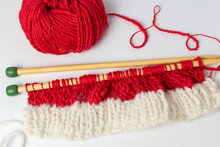 Christmas Knitting Background With Red Wool And Needles 