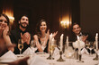 © Jacob Lund - High society people clapping hands at dinner party