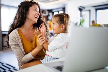 Wall Mural - young mother with child working from home office
