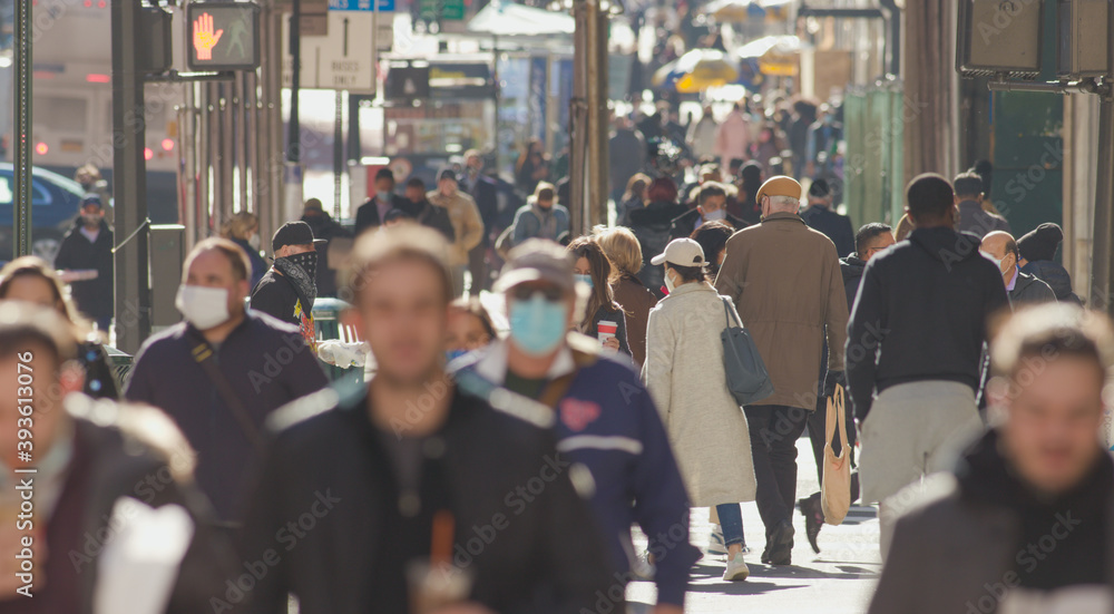 Crowd of people walking street wearing masks in New York City during Covid 19 coronavirus pandemic in 2020 - obrazy, fototapety, plakaty 