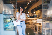 Half Length Of Cheerful Caucaisan Entrepreneur Feeling Success In Franchise Coffee Shop Standing In Doorway And Smiling At Camera, Happy Self Employed Woman Working In Local Cafeteria Industry