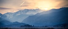 Scenic View Of Snowcapped Mountains Against Sky During Sunset