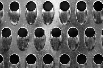 Vegetable slicer, grater abstract close up macro shot for background, in black and white.