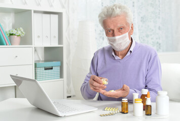 Sticker - Portrait of sad sick senior man with facial mask