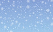 © KrikHill - Snow background. Winter snowfall. White snowflakes on blue sky. Christmas background. Falling snow.