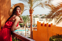 Young Woman Enjoying Swimming Pool, Palms View From Hotel Balcony In Egypt. Vacation In Tropical Resort