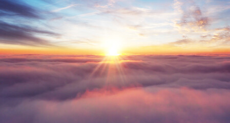 Wall Mural - rising sunset above the clouds