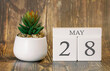 Flower pot and calendar for the warm season from 28 May. Spring time.