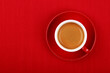 © breakingthewalls - Cup of espresso coffee on red saucer