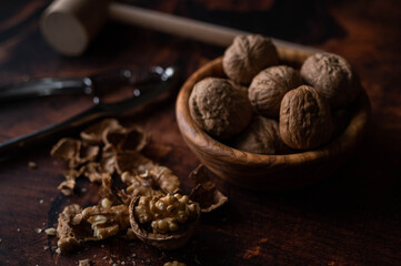 Wall Mural - walnut with nutscracke on dark wooden backgrround