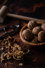 Wall Mural - walnut with nutscracke on dark wooden backgrround