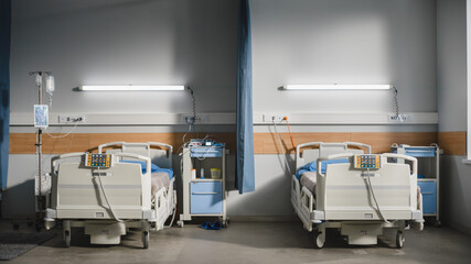 Shot of Technologically Advanced Hospital Ward without People, Ready for Injured Patients and Sick People. Real Modern Medical Equipment for Providing Patient Treatment. Side View Shot.