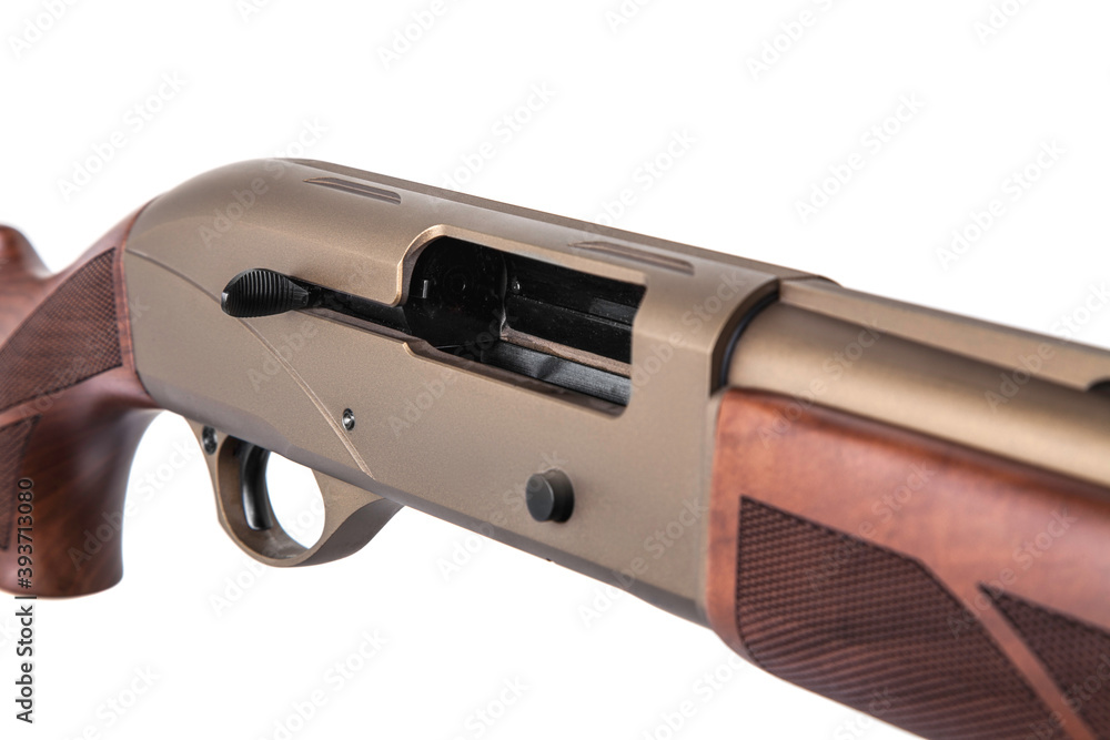 Modern semi-automatic shotgun. Weapons for sports and hunting. A bronze-colored weapon with a wooden stock isolate on white back