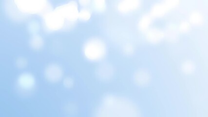 A baby shower themed motion background with a soft baby blue tone and cotton colored bokeh circles floating and falling from the sky motion background.