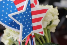 Close-up Of American Flag And Flowers