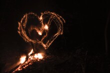 Heart Shape Formed Over Bonfire At Night