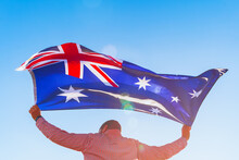 Man With A Flag Of Australia Standing In Field