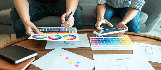 Wall Mural - team of creative web/graphic designer planning, drawing website ux app for mobile phone application 