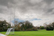 Training ground with goalposts for Irish National sports camogie, hurling, gaelic football and rugby, nobody, Cloudy sky and trees in the background