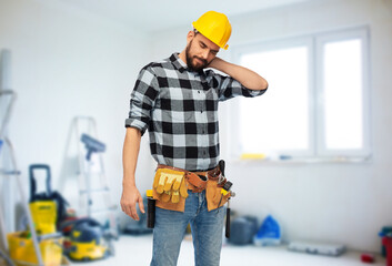 health, construction and repair concept - male worker or builder in helmet with neck pain over room with building equipment background