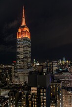 Low Angle View Of Illuminated Empire State Building Against Sky At Night