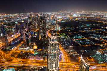 Wall Mural - Night aerial view of Dubai from the top of  Burj Khalifa Tower in Dubai, United Arab Emirates, the tallest building in the world.