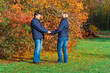 © soleg - couple walking in autumn city park, happy people together, beautiful nature with colorful leaves