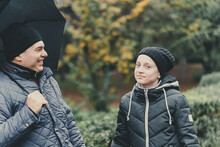 Father And Daughter Talking And Posing With Umbrella, Autumn City Street, Happy People Together, Parent And Children