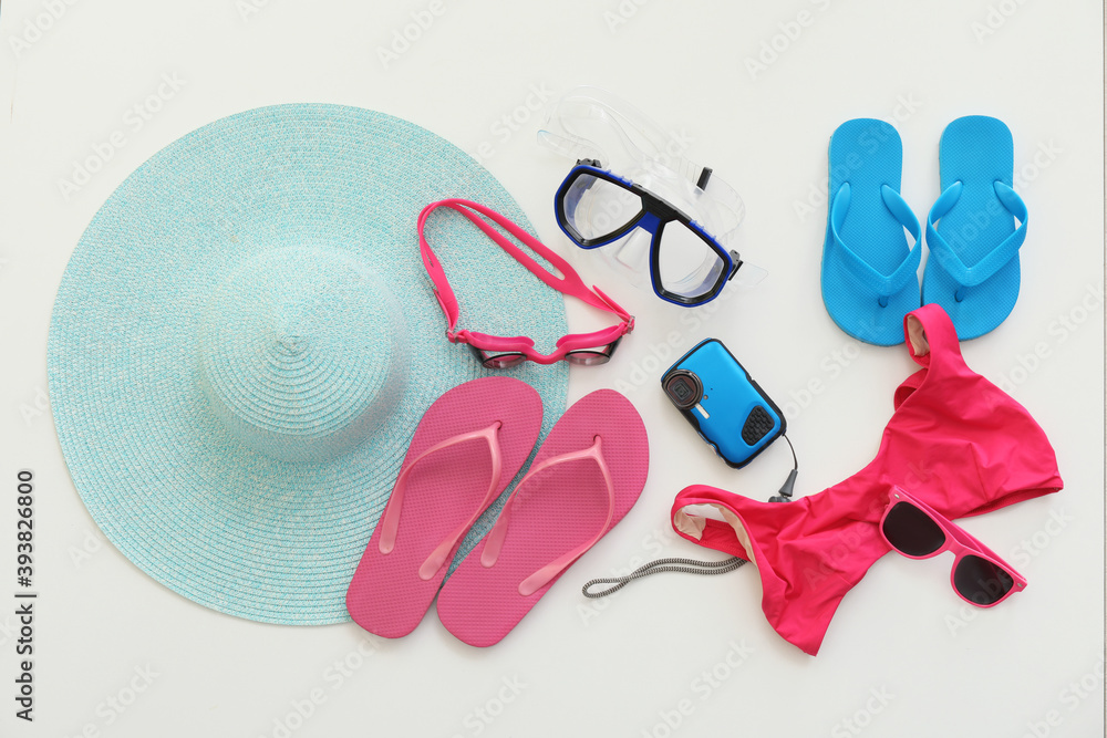 Set of beach accessories on white background