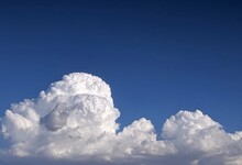 Huge Cloudscape Against A Clear Blue Sky