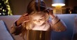 © VAKSMANV - Close up portrait of cheerful Caucasian little girl opening christmas present box with surprised happy face. Beautiful female receive xmas gift with excited face. New Year spirit. Holidays celebration