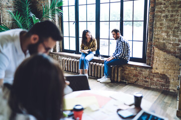 Sticker - Coworkers resting near window after discussing project