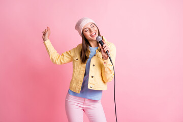 Sticker - Photo of funky cute lady dance sing song wear cap jacket trousers isolated on pastel pink color background